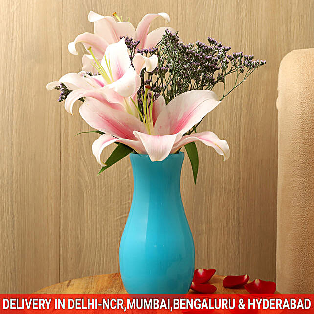 Buy/Send Pink Oriental Lilies In Blue Glass Vase Online- FNP
